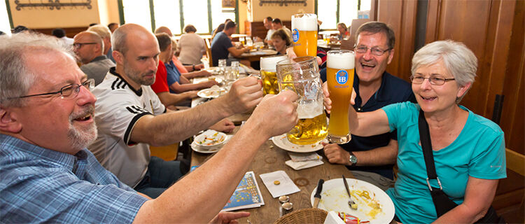 Tour members with beers in Germany