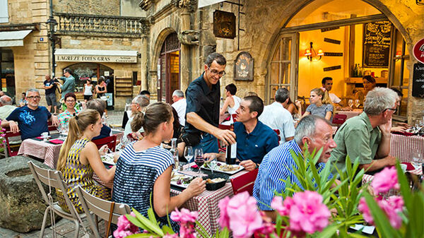 Diners at an outdoor cafe, Sarlat, France