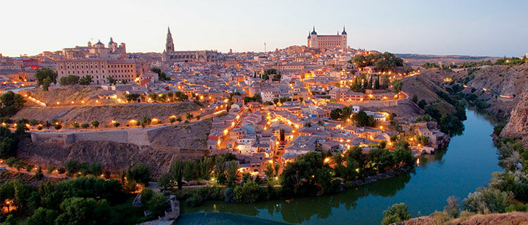 Skyline with lights at dusk, Toledo, Spain
