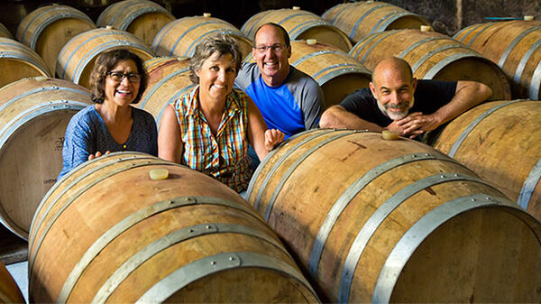 People and wine barrels, France