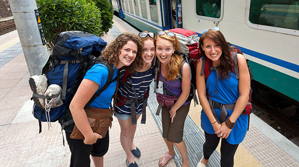 Backpackers at train station, Cinque Terre, Italy