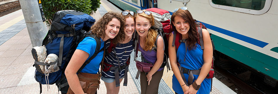 Backpackers at train station, Cinque Terre, Italy