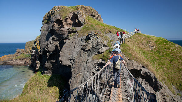 Walkers on Carrick-a-Rede rope bridge, County Antrim, Northern Ireland