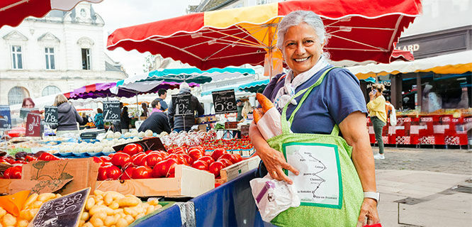 woman shopping at market in beaune france