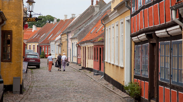 Three people walking down street, Ærø, Denmark