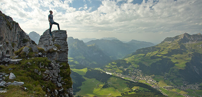 Tourist atop mountain overlook, Switzerland
