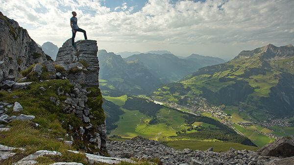 Tourist atop mountain overlook, Switzerland