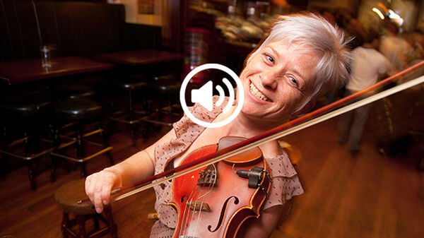 Woman playing fiddle, Ireland