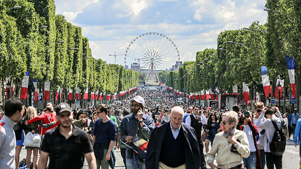 People strolling in street parade, Paris