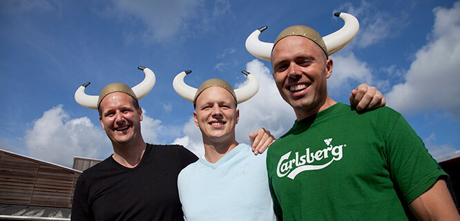 Three guys in horned helmets at Viking Museum, Roskilde, Denmark