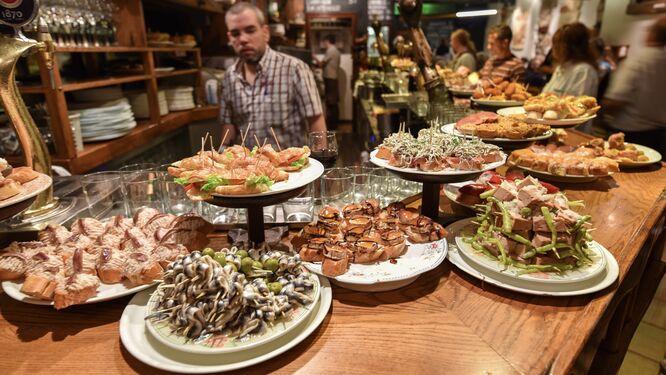 Bar offering plates of pintxos (Basque tapas), San Sebastián