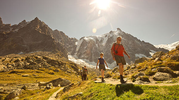 Hikers in bright sun, French Alps