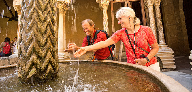 couple-at- fountain-in-monreale-cathedral-in sicily