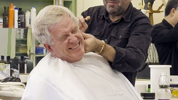 Rick getting a flaming shave at barbershop, Istanbul, Turkey
