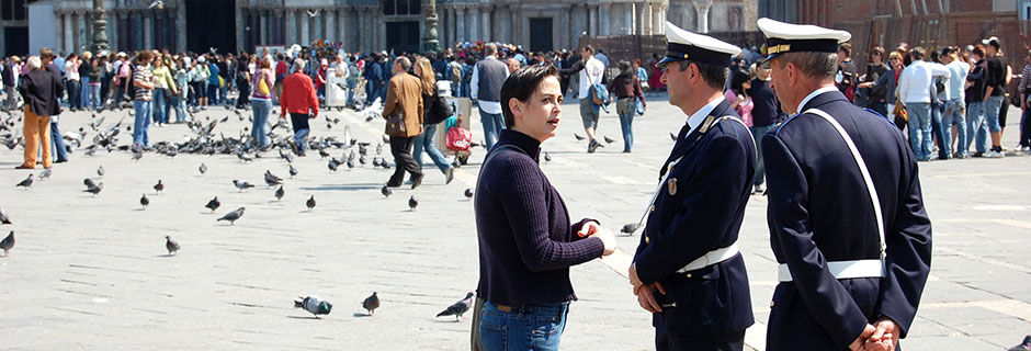 Lady with police officers, Venice, Italy