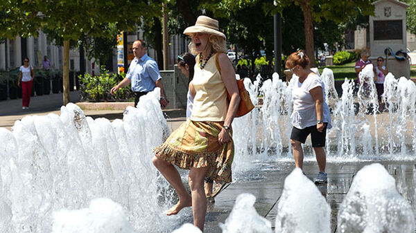 lady walking in matthias fountain in budapest