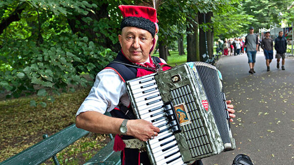 Man with accordion, Planty Park, Krakow, Poland
