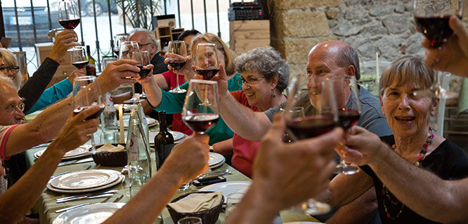 group of people toasting with wine