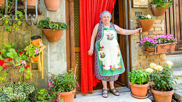 lady surrounded by flower pots