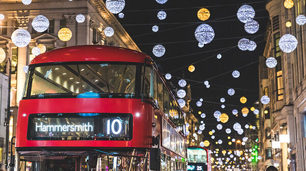 Red bus and Christmas street lights at night, London, Englamd