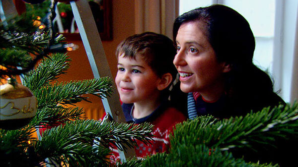 Mom and young son with Christmas tree
