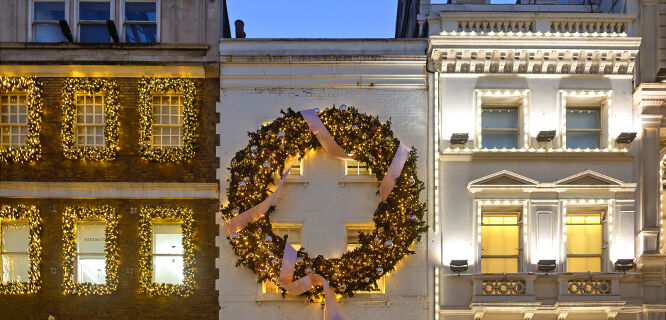 Christmas decorations at dusk on Bond Street, London, England