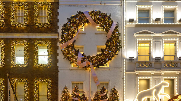 Christmas decorations at dusk on Bond Street, London, England