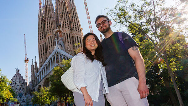 Couple in front of Sagrada Familia, Barcelona, Spain