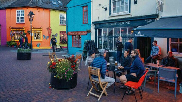 Colorful buildings and outdoor diners, Kinsale, Ireland