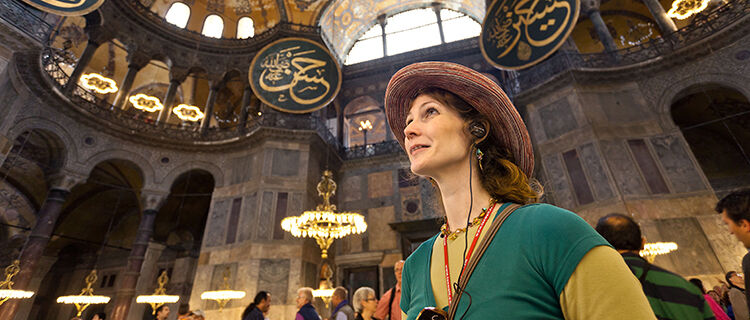 Woman looking up at mosque ceiling, Istanbul, Turkey