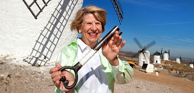 lady-holding-key-in-front-of-spanish-windmill