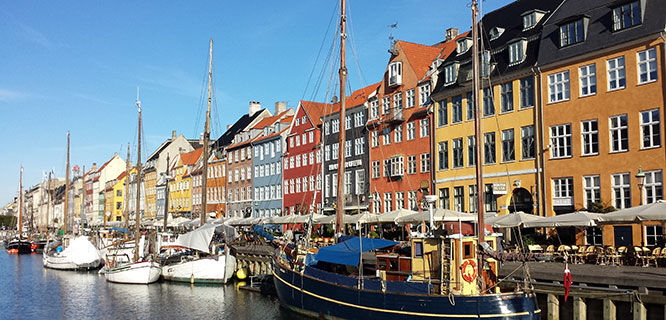 colorful buildings and boats in nyhavn copenhagen