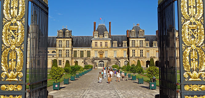 front gate of fontainebleau-castle in france