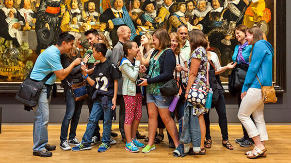 Kids in front of painting on family tour, Rijksmuseum, Amsterdam, Netherlands