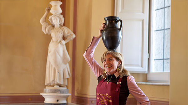 Italy guide Cecilia Bottai with pitcher on head
