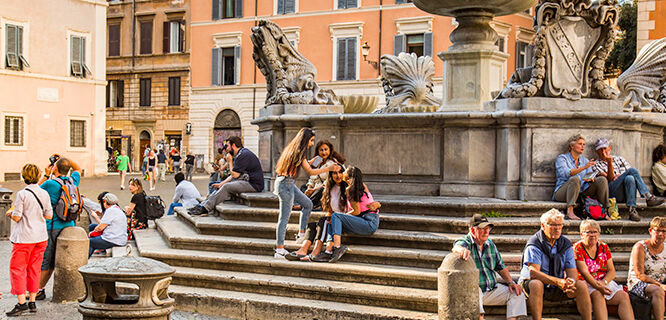 People on steps of fountain, Piazza di Santa Maria, Trastevere, Rome