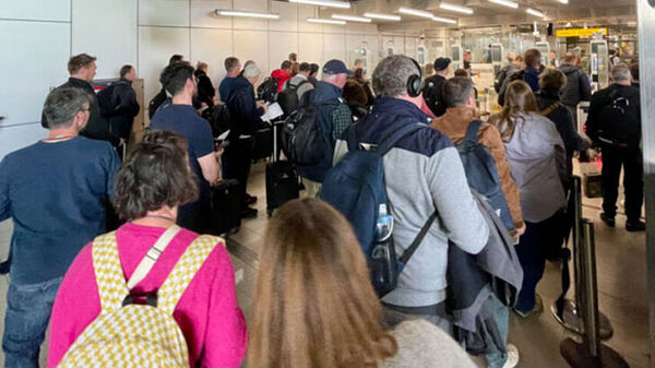 Travelers arriving at airport terminal
