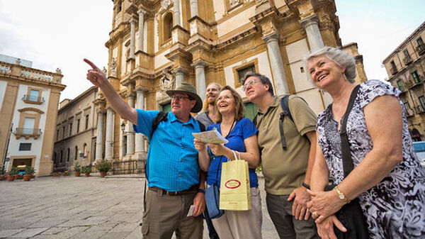 four people in square in palermo