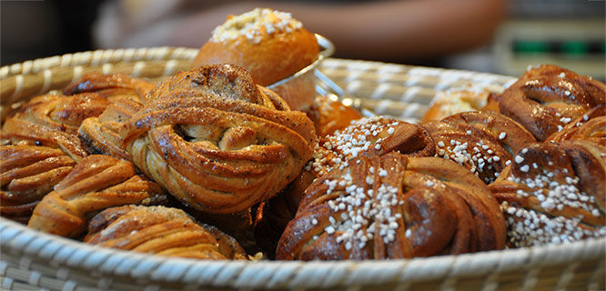 white basket filled with cardamom buns