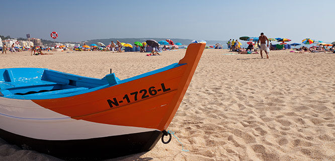 row boat on sandy beach