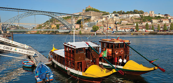 two boats on river below a bridge