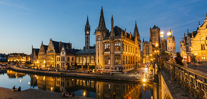 canal with buildings lit up at night