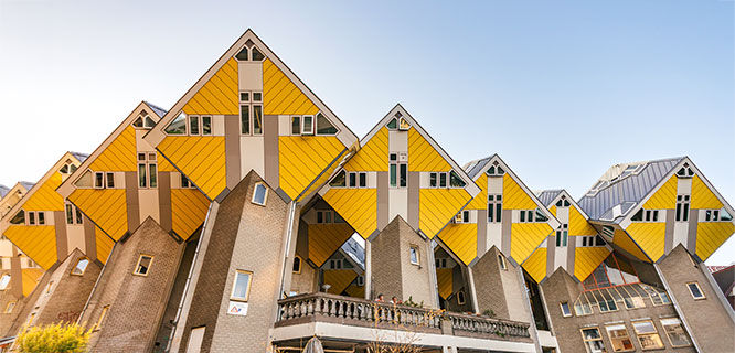 a row of yellow cube shaped houses