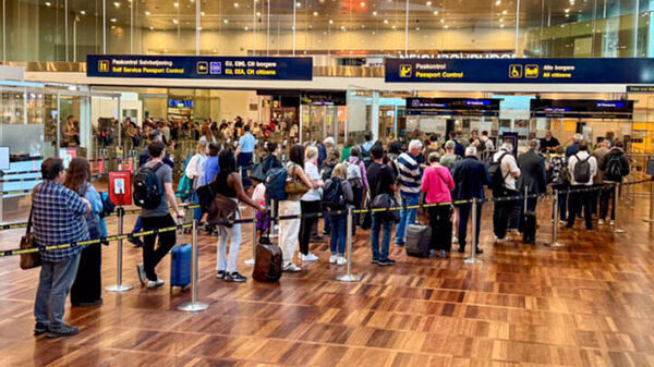 Travelers at immigration checkpoint, Copenhagen, Denmark
