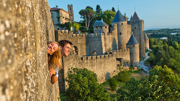 Carcassonne, France - a couple looking out the window