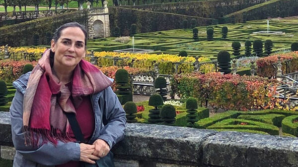 woman with garden in background