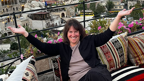 womann sitting on paterned couch