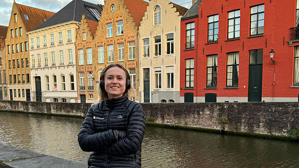 woman with colorful buildings in background