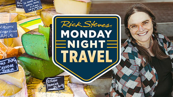 wedges of cheese on right woman wearing glasses on left