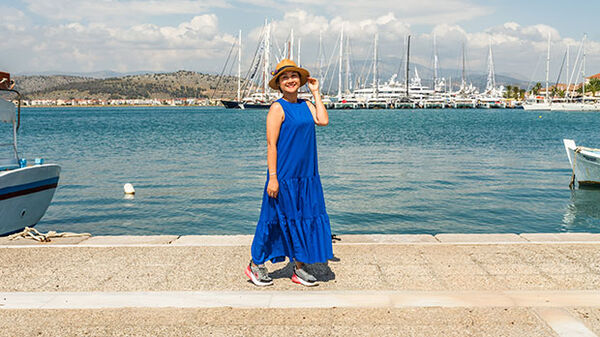 Lady in blue dress, Nafplio harbor, Greece